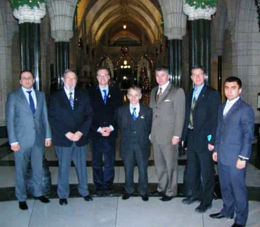 Декабрь 2010, Канада, встреча с парламентариями Канады. Перый справа - Арсен Жумадилов, первый слева - Рустем Умеров